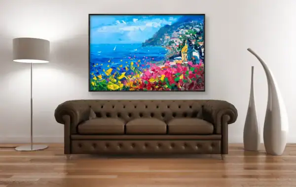 Original Positano oil painting by Agostino Veroni hanging above a classic brown leather Chesterfield sofa, highlighting the warm Italian colors.