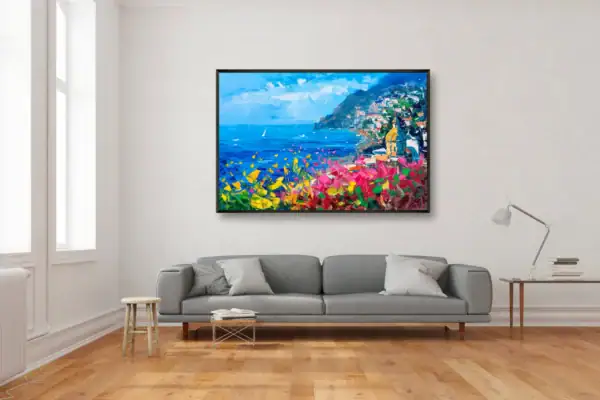 Modern apartment interior featuring an original Positano oil painting by Agostino Veroni above a grey sofa, ideal for contemporary wall decor.