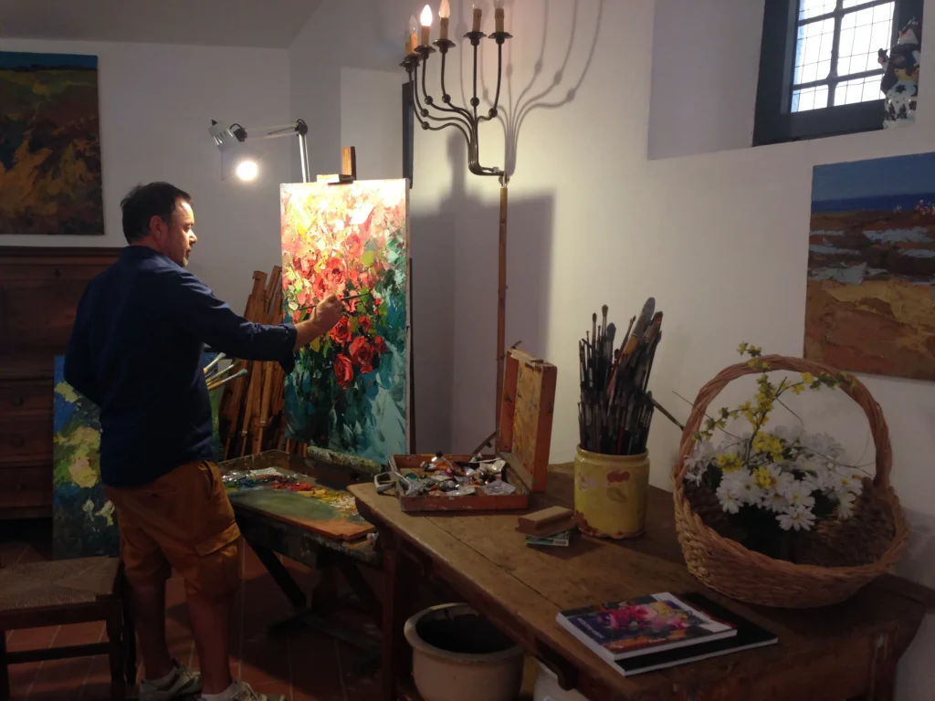 Italian oil painter Agostino Veroni working in his art studio at Villa Minghetti