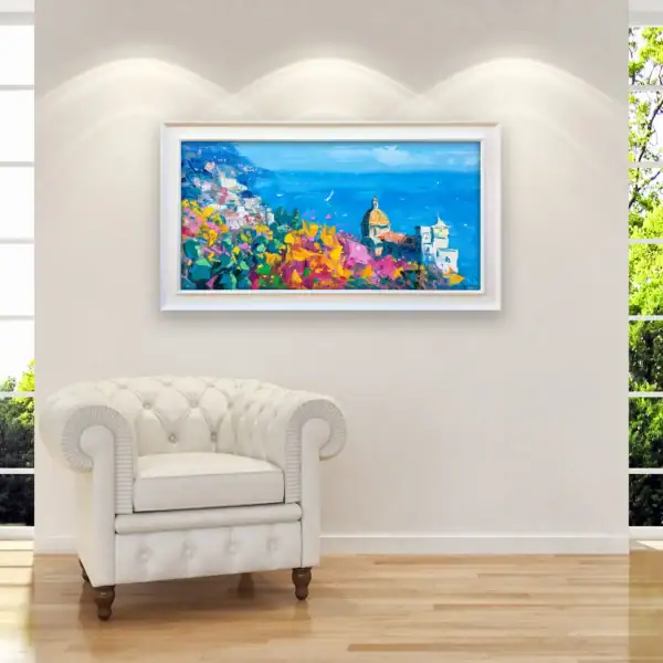Original Positano oil painting with prickly pears and flowers, featured in a bright contemporary living room next to a white leather armchair.