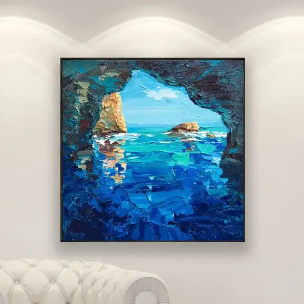 Original Blue Grotto oil painting by Agostino Veroni styled above a luxury white Chesterfield armchair, showcasing its impact in a high-end living room.