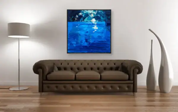 An original Blue Grotto oil painting by Agostino Veroni hanging in a classic living-room above a dark brown leather Chesterfield sofa, flanked by two tall white decorative vases and a floor lamp.