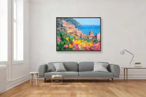 Contemporary living room featuring a colorful Positano oil painting by Agostino Veroni above a modern grey sofa.