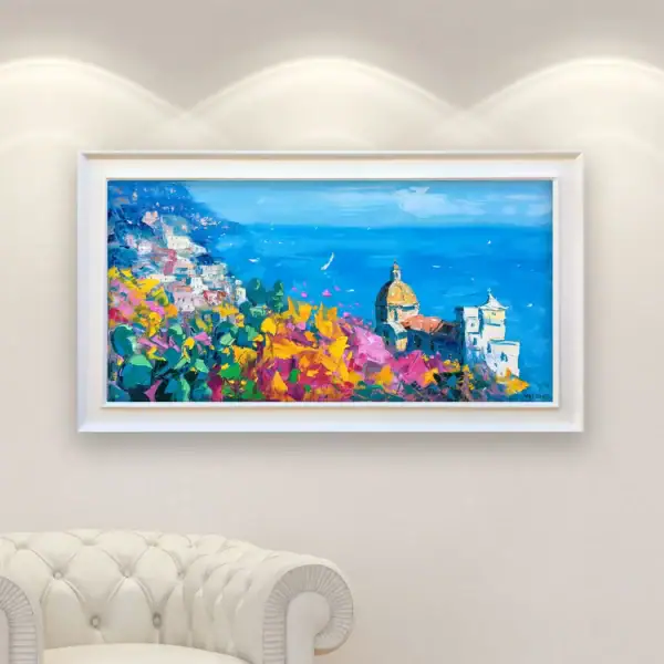 Panoramic oil painting of Positano by Agostino Veroni hanging on a white wall, showing how the vibrant floral scene enhances a refined interior space.
