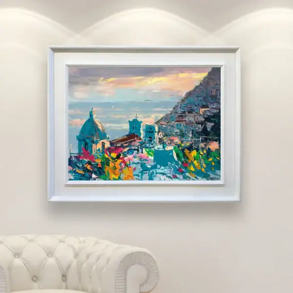 Detailed view of Agostino Veroni's original sunset oil painting of Positano in a contemporary interior, showing its elegant turquoise and warm tones on a white wall.