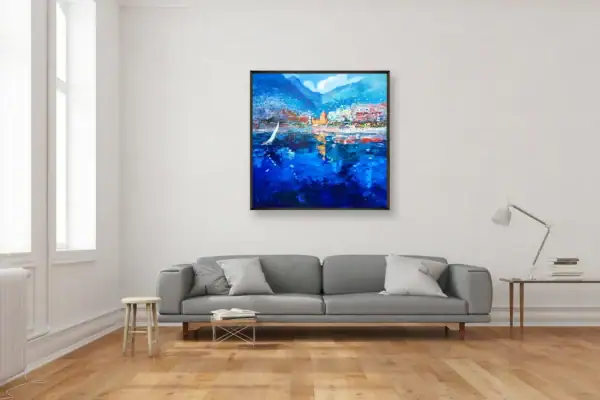 Agostino Veroni's vibrant Mediterranean scene painting with a sailboat, displayed in a bright contemporary living room over a grey sofa.