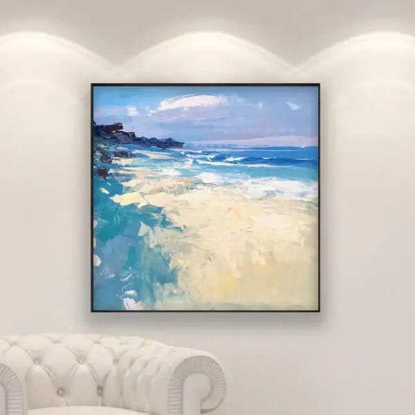 An original beach oil painting by Agostino Veroni displayed in a bright, modern living room above a white leather sofa.