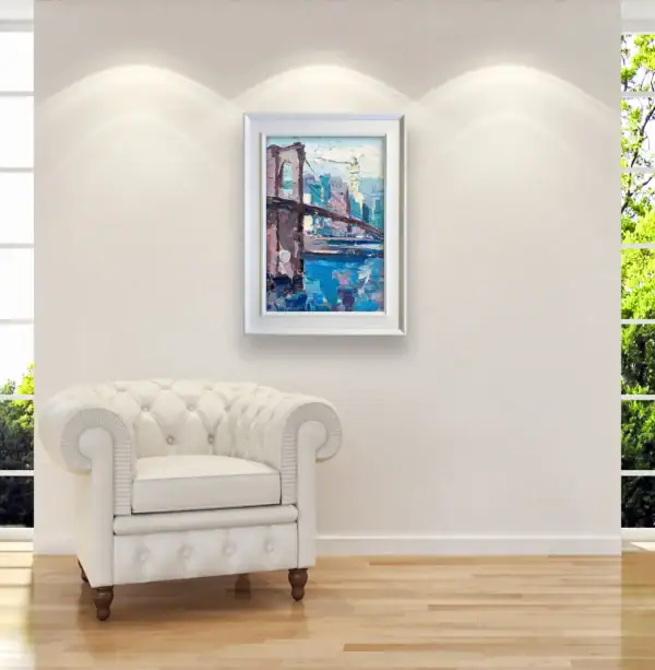 Original Brooklyn Bridge cityscape by Agostino Veroni styled in a bright, modern room above a white leather armchair.