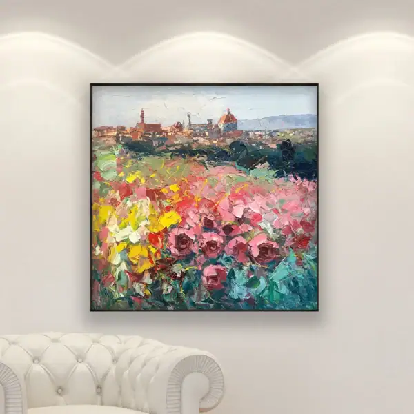 An original oil painting of Florence by Agostino Veroni, featuring Duomo and roses, displayed above a white leather armchair.