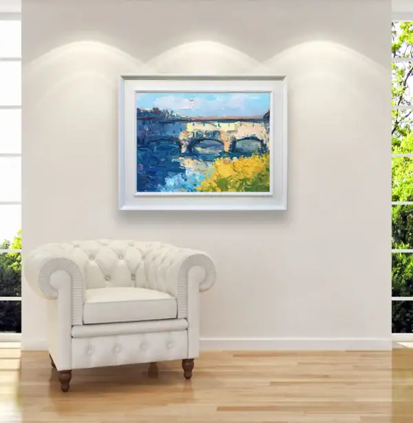 Original Italian oil painting of Ponte Vecchio by Agostino Veroni styled in a sophisticated office or lounge area with a white armchair.