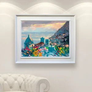 Sunset Positano oil painting on canvas displayed in a refined interior, featuring warm evening light over the coastal village and sea.