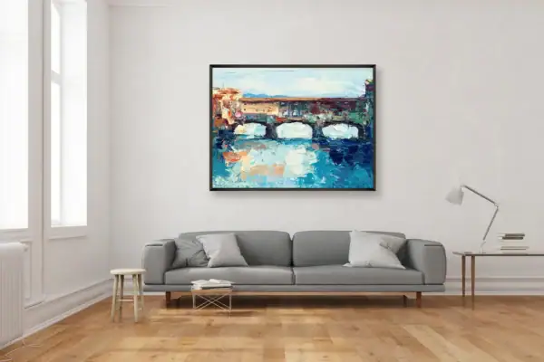Italian cityscape oil painting of Ponte Vecchio by Agostino Veroni hanging above a modern grey sofa, ideal for home decor inspiration.