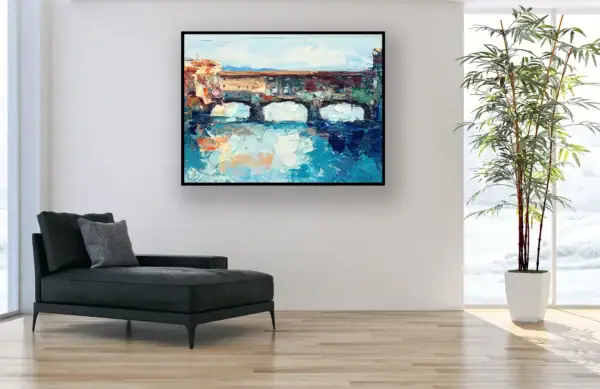 An original Ponte Vecchio Florence oil painting by Agostino Veroni displayed in a contemporary office setting with a black chaise longue.