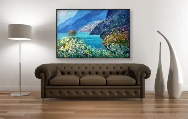 Original Positano landscape oil painting by Agostino Veroni shown above a classic brown tufted leather sofa in a spacious living room.