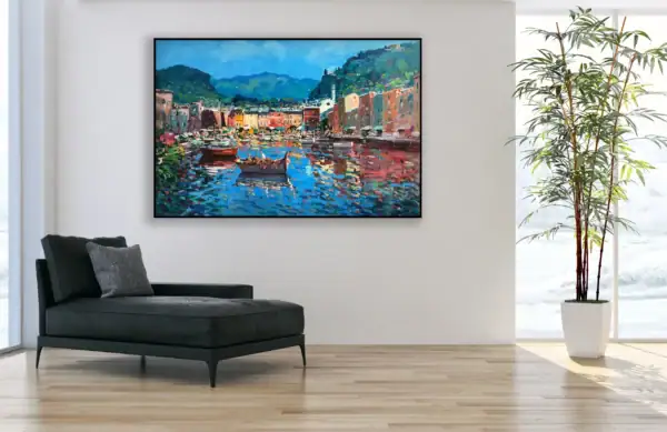 Modern interior design featuring an original Portofino seascape painting on a white wall next to a black chaise longue.