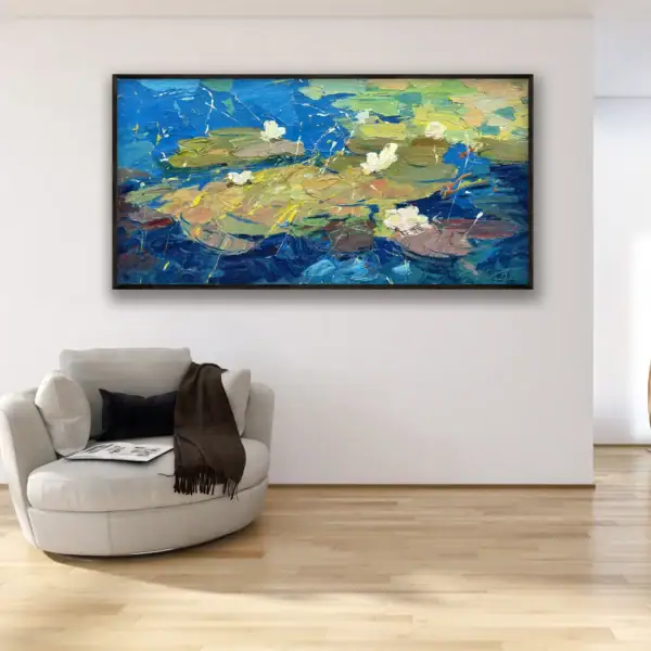 Elegant living room interior with an original water lilies oil painting by Agostino Veroni on a white wall, showcasing contemporary floral home decor.