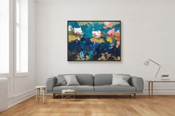 An impressionist water lilies oil painting by Agostino Veroni hanging as a central focal point in a bright contemporary living room above a large light grey sofa.
