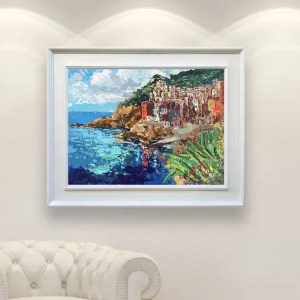 Vibrant horizontal landscape of Riomaggiore shown in a contemporary living space, highlighting the colorful houses and the wide coastal view.