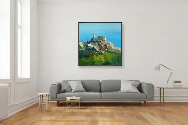 Original square oil painting of Portovenere by Agostino Veroni, in a black frame, hanging above a contemporary grey sofa in a modern interior.