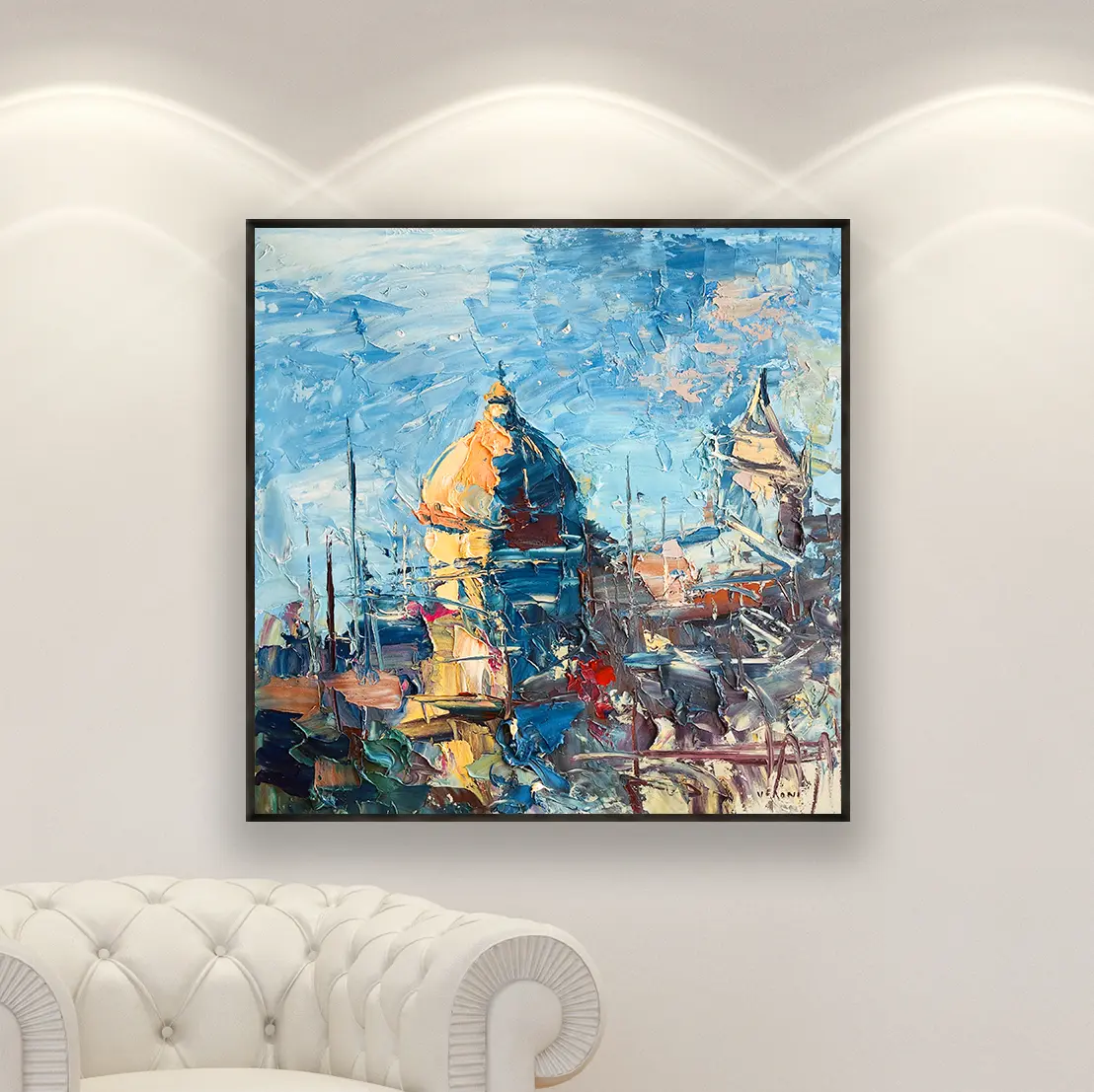 A bold and colorful original Positano oil painting with heavy impasto, shown in a modern home gallery setting highlighting its vibrant blue and gold tones.