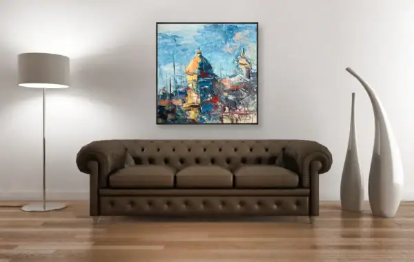 Agostino Veroni's original textured oil painting of Positano's church dome, displayed above a classic brown leather Chesterfield sofa in an elegant interior.