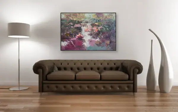 The water lilies oil painting featured as a focal point above a classic brown leather Chesterfield sofa, showing its versatility in luxury home decor.