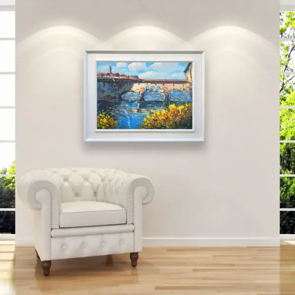 The original Florence painting in a bright, modern interior next to a classic white leather armchair, creating a luxury focal point.