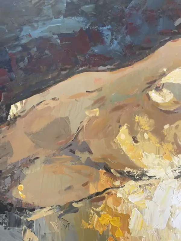 Detailed view of the reclining silhouette against the deep blue background, highlighting the contrast between warm skin tones and cool shadows.