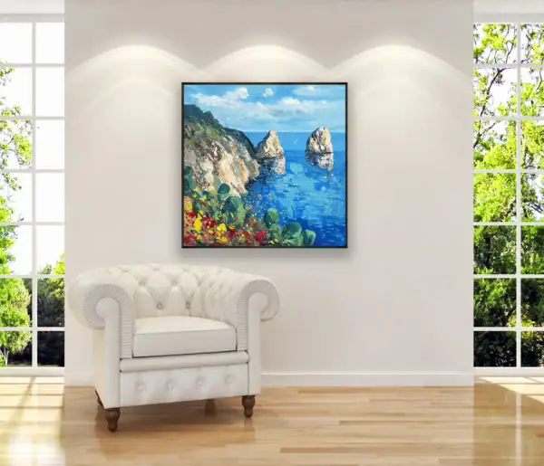 Agostino Veroni's Capri painting displayed in a bright, elegant room next to a white classic armchair, highlighting its vibrant summer atmosphere.
