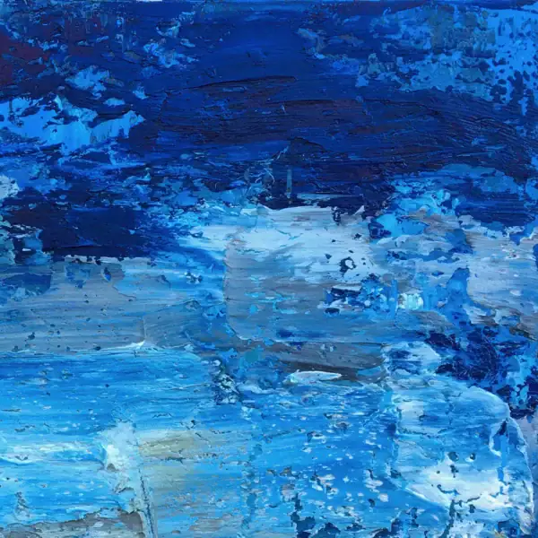 Macro close-up view highlighting the thick, sculptural palette knife layers of deep cobalt blue and white oil paint.