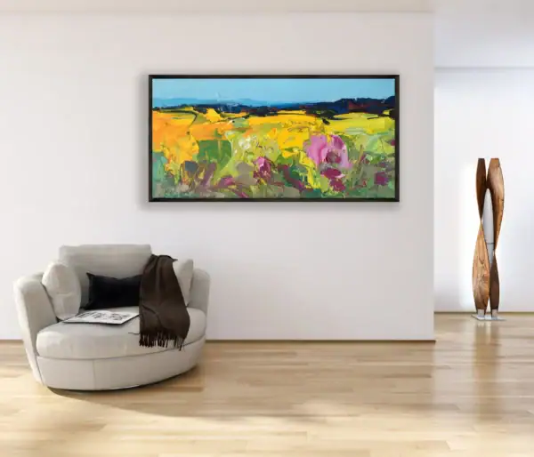 A large horizontal abstract sunflower oil painting displayed in a bright, modern living room, adding a vibrant and artistic touch to the space.