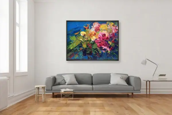The square abstract rose oil painting styled as a centerpiece on a neutral wall in a contemporary living room above a grey sofa.