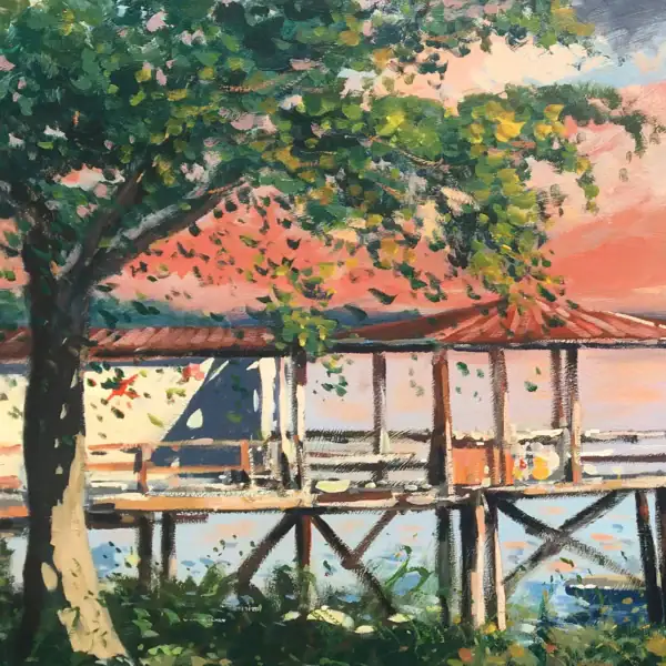 Close-up vertical detail highlighting the lush green foliage of an old oak tree and the textured wooden dock under a warm sunset sky.