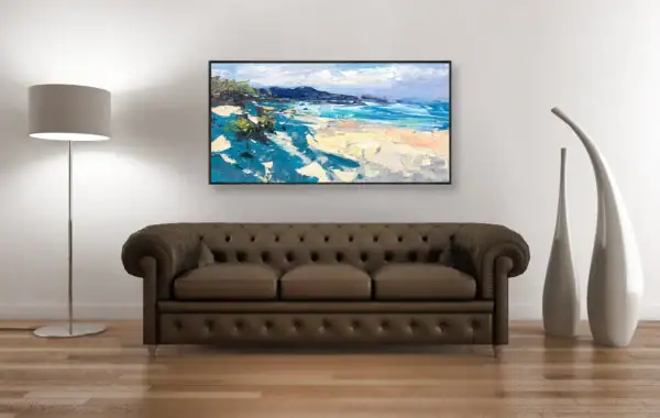 The modern impressionist coastal beach painting in a luxury classic interior, perfectly positioned above a brown leather Chesterfield sofa.