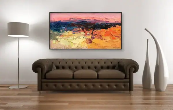 Original abstract oil painting by Agostino Veroni with warm ocher and pink tones, featured as a focal point above a classic brown leather sofa in a luxury home setting.