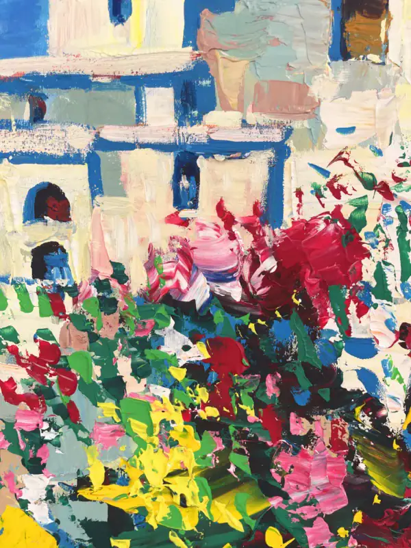 Macro view focusing on the heavy impasto floral blossoms in pink and red against the sunlit white walls of the coastal town architecture.