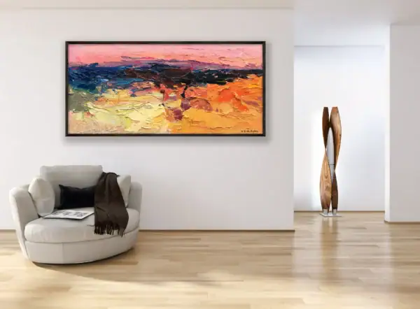 Horizontal abstract landscape oil painting hanging in a clean, white-walled modern room above a stylish white armchair, showcasing the painting's vibrant texture.