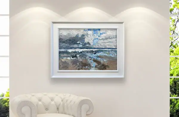 Close-up display of the framed beach seascape painting on a neutral wall, showcasing its beautiful integration into a luxury home interior setting.