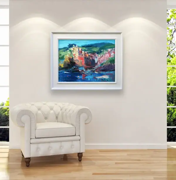 Large framed Cinque Terre landscape painting styled beautifully as a colorful, sun-drenched focal point in a bright luxury lounge room.