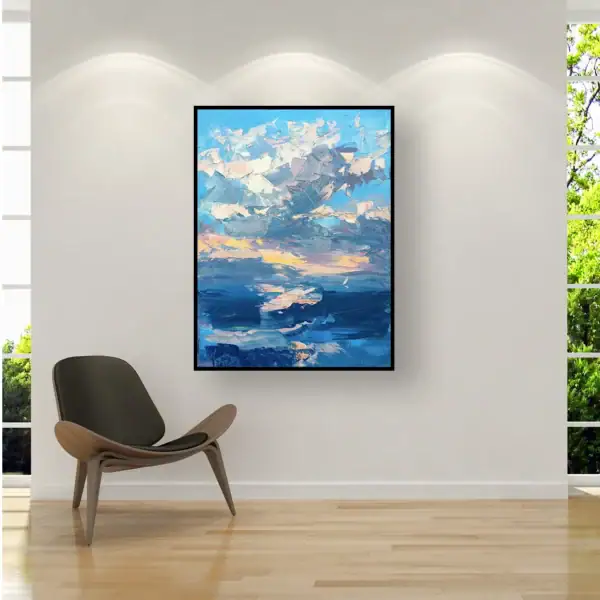 Large vertical sunset seascape canvas styled in a sophisticated luxury office or modern living room near an accent armchair.