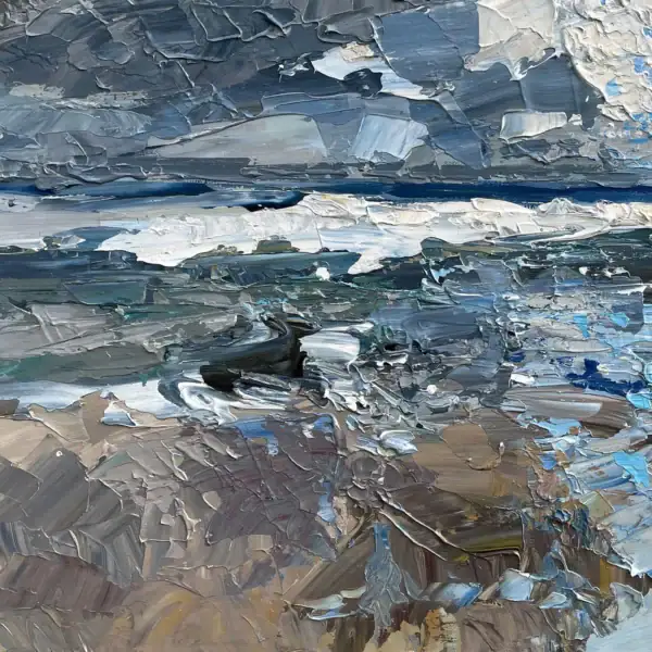 Macro detail of the breaking sea waves on the shore, showcasing the rich texture and earthy tones of the wet sand and white sea foam.