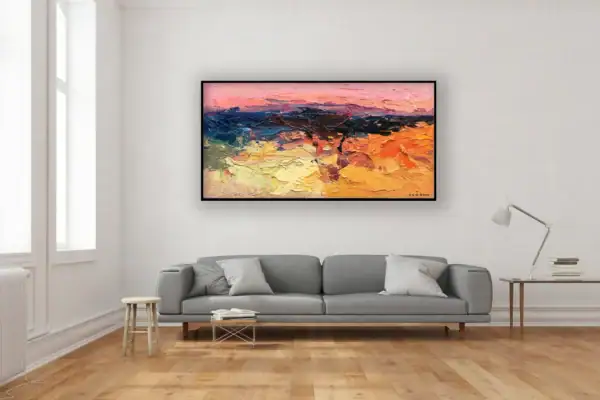 A large horizontal abstract landscape oil painting by Agostino Veroni, featuring a soft pink sky, hanging in a bright modern living room with a grey sofa and minimalist decor.