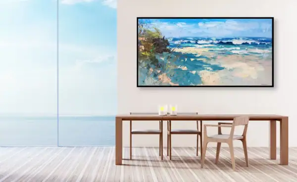 The large horizontal beach oil painting displayed in a modern dining room with a wooden table next to a panoramic window overlooking the sea.