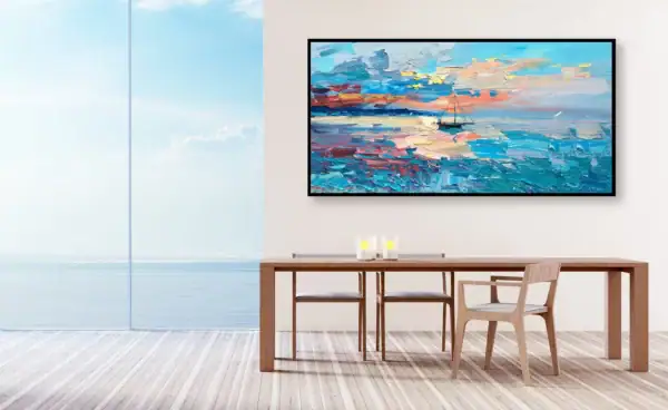 The large horizontal marine artwork elegantly displayed in a bright minimalist dining room with a wooden table facing a panoramic ocean window.