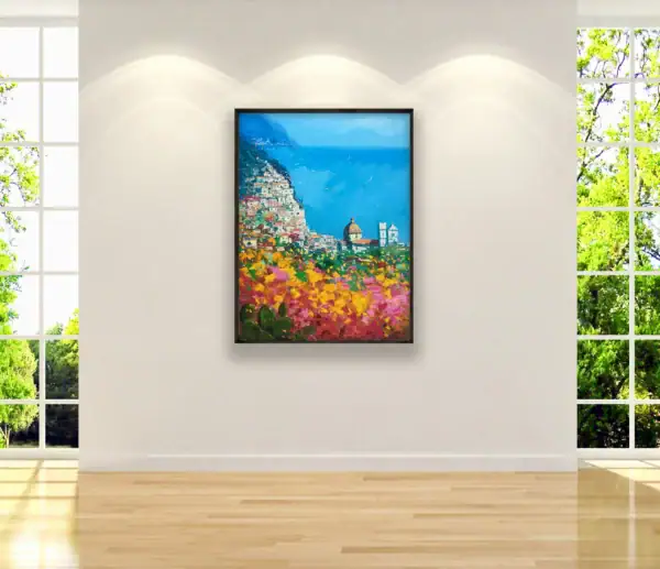 Vertical original oil painting of Positano by Agostino Veroni, displayed on a bright wall next to a large window with garden view, showing how the artwork enhances a luxury living space.