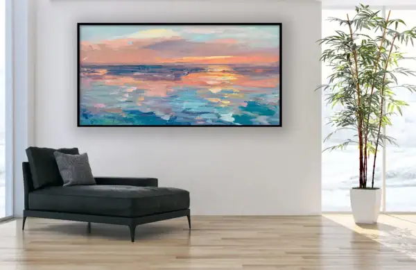 The horizontal abstract coastal canvas hanging styled in an elegant room next to a black leather chaise longue and a tall potted plant.