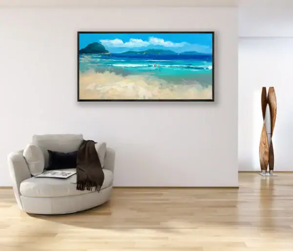 The large horizontal tropical beach seascape hanging on a white living room wall next to a cozy circular armchair.