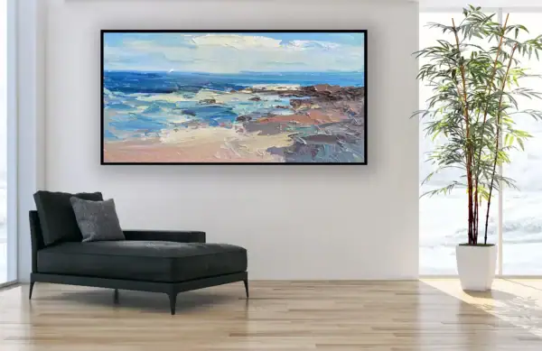 The horizontal sea breeze landscape canvas displayed in a bright modern interior next to a black leather chaise longue.