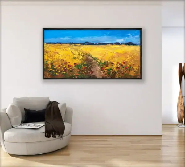 The large horizontal framed Tuscan country painting shown from a perspective angle in a bright, minimalist modern home interior.