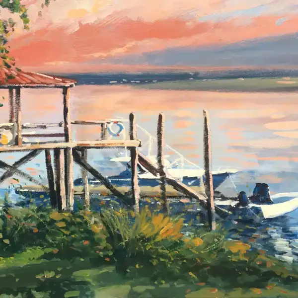 Detailed macro view focusing on the hand-painted wooden stilt dock and motorboats moored on the glowing twilight water.